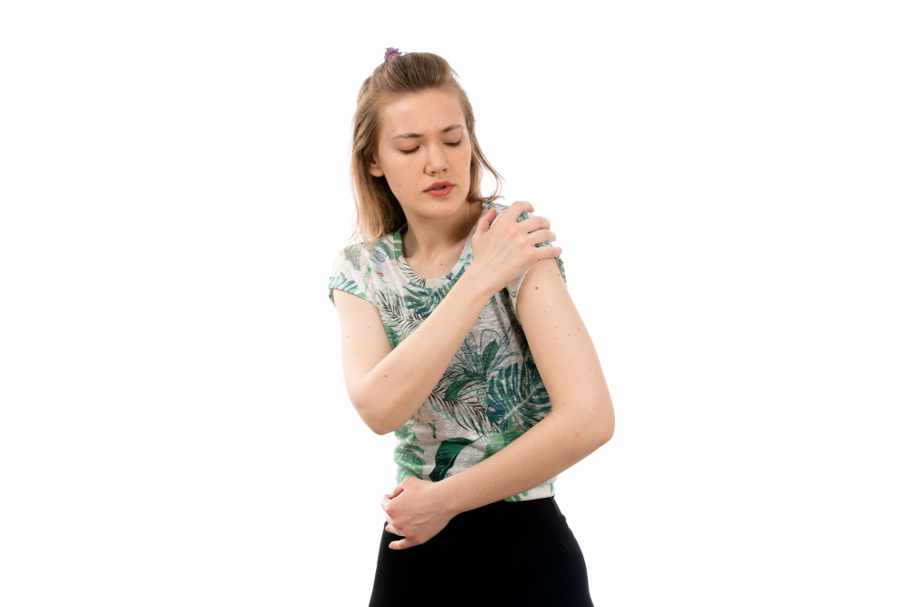 a girl having shoulder pain